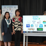 Lieutenant Governor Luke and Hawaii legislators stand with a TV displaying "Ready Keiki" and school logos.