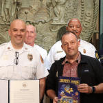 Lt. Gov. Sylvia Luke with Gov. Josh Green and fire chiefs smiling for a group photo.